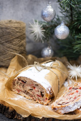 Traditional Stollen in the section on the background of Christmas tree