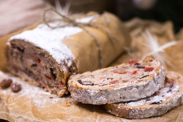 Traditional Stollen cut on paper background soft focus
