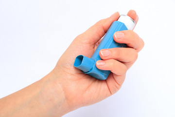 Human hand holding inhalator