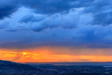 Sunset and Rain Over City, Lake Constance