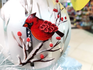 ball with a red bird on a branch
