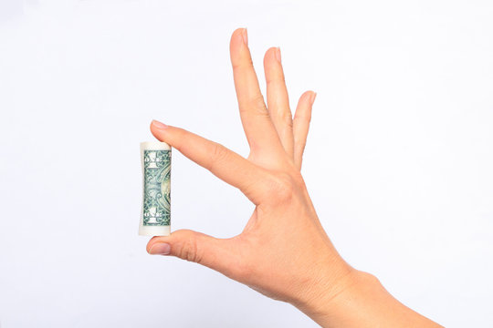 Dollar money roll in hand