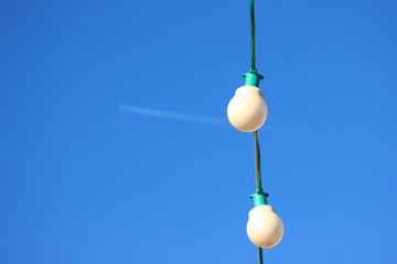 Christmas and new year decorations of houses and yard area. Christmas trees and trees are decorated with balls and toys. Festive mood is in the air and airplane