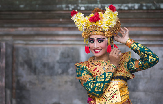 Balinese legong dancer in traditional outfit and full make up 