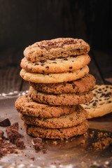 Healthy homemade, oatmeal cookies on a black  background. Baking for Christmas and New Year
