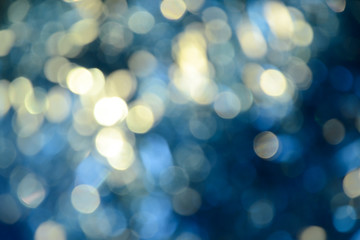 Bokeh photo. Holiday background. Christmas lights. background. Defocused sparkles. New Year...
