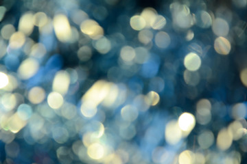 Bokeh photo. Holiday background. Christmas lights. background. Defocused sparkles. New Year backdrop. Festive wallpaper. Blinks. Carnival. Retro style photo.