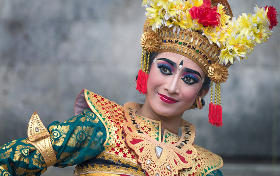 balinese legong dancer in traditional outfit and full make up 