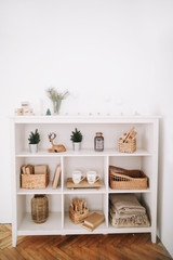 Cozy children room. A shelf with toys. New Year festive interior. Christmas decorations. Holiday concept. 