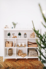 Cozy children room. A shelf with toys. New Year festive interior. Christmas decorations. Holiday concept. 