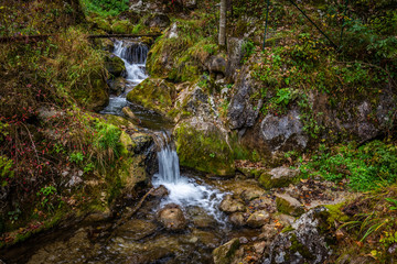 Cascade falls over mossy rocks at Myrafalle, near Muggendorf in Lower Austria