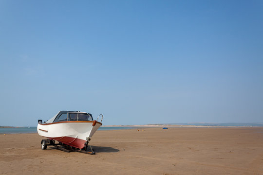boats rest on the sand at Instow beach, devon