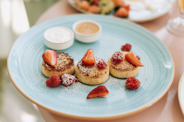 breakfast of cheesecakes with fruit