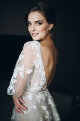 Fototapeta premium bride in a dress with an open back