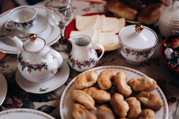 cup of coffee and cookies on table