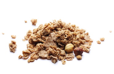 Crunchy granola, muesli pile with nuts isolated on white background