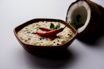 Nariyal or Coconut Chutney served in a bowl. Isolated over moody background. selective focus