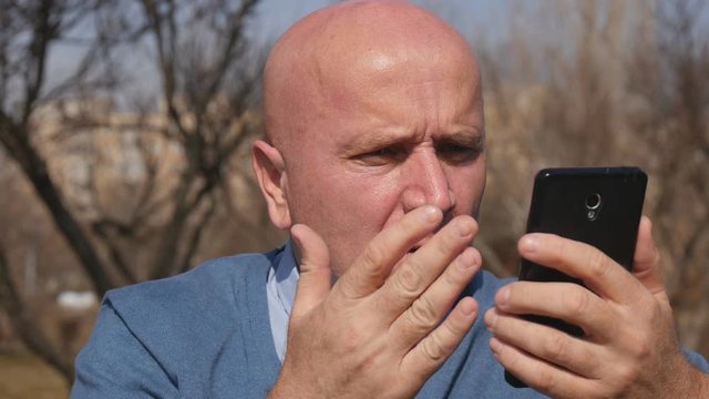 Slow Motion with Upset Man Reading Cellphone Bad News and Gesturing Disappointed