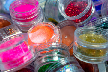 Multicolored decorative elements. Nail design. Tinsel for decoration of clothes, makeup