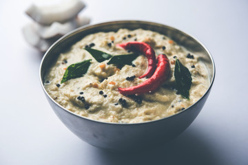 Nariyal or Coconut Chutney served in a bowl. Isolated over moody background. selective focus
