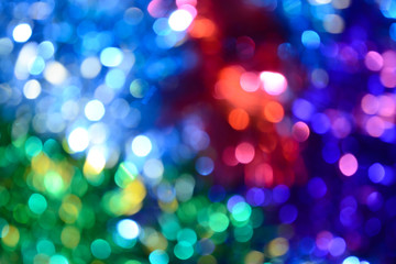 Bokeh. Holiday background. Christmas lights. Glitter. Defocused sparkles. New Year backdrop. Festive wallpaper. Blinks. Carnival. Tinsel. Bokeh retro style photo.