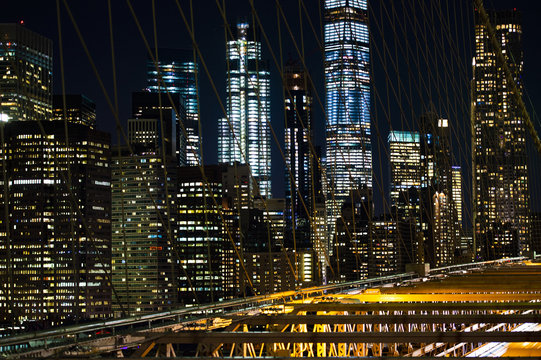 Beautiful illuminated Manhattan's skyline at dusk. Picture taken from the Brooklyn Bridge, New York, USA.