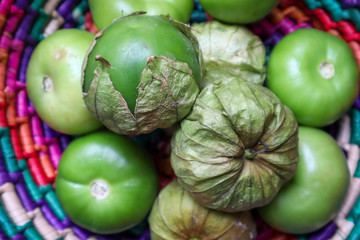 Fresh Tomatillos with Husk in Basket in Mexico (overhead)