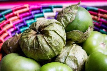 Fresh Tomatillos with Husk in Basket in Mexico (close-up)