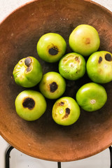 Roasting Tomatillos on a Comal in Mexico City (overhead)