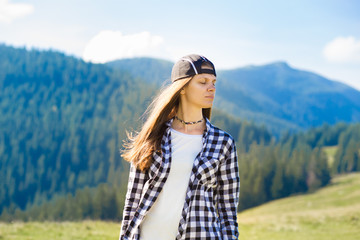 Serenity young tourist woman on top of mountains contemplating view and enjoy freedom