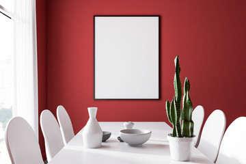 Red dining room, white chairs, poster