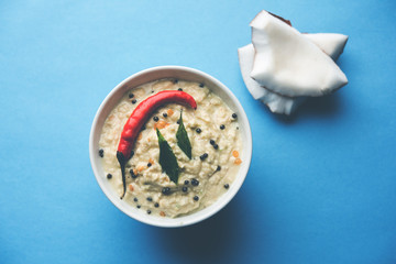 Nariyal or Coconut Chutney served in a bowl. Isolated over moody background. selective focus