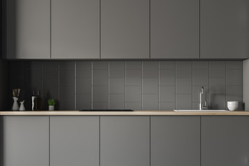 Gray countertops in tiled kitchen