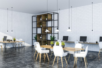 White and brick office corner with table