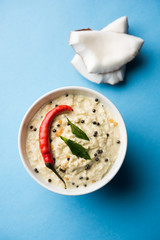 Nariyal or Coconut Chutney served in a bowl. Isolated over moody background. selective focus