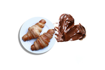 Two croissants in the white plate