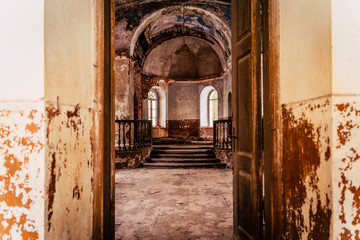 Obraz na płótnie Canvas Inside Interior of an old Abandoned Church in Latvia, Galgauska - light Shining Through the Windows