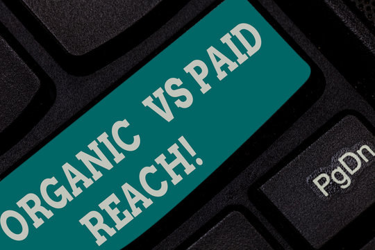 Writing note showing Organic Vs Paid Reach. Business photo showcasing Increasing followers naturally or by paying for it Keyboard key Intention to create computer message pressing keypad idea