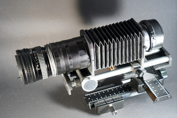 In macro photography and photomicrography, a bellows device is very helpful and almost indispensable