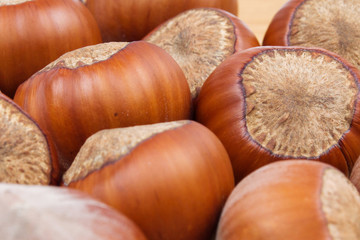 Handful of hazelnuts on wooden background