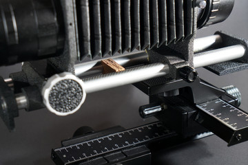 In macro photography and photomicrography, a bellows device is very helpful and almost indispensable