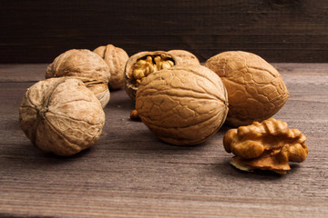 Handful of Walnuts on wooden background