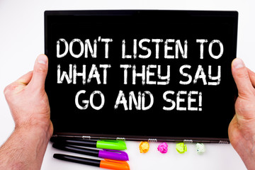 Handwriting text writing Don T Listen To What They Say Go And See. Concept meaning Confirm Check by yourself