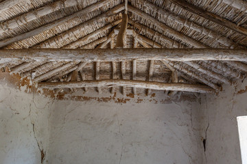 View of the wooden roof in the interior of an old abandoned house