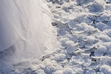 texture of large flakes of salt and the hem of a wedding dress