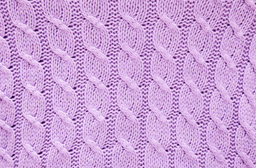 Knitted violet texture. Horizontal shot
