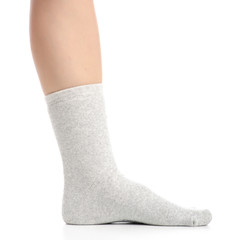 Female legs in gray socks on white background. Isolation