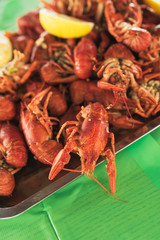 a lot of hot fresh boiled red crawfish