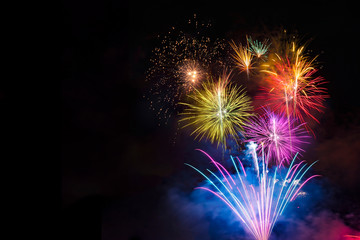 Fireworks display over dark sky