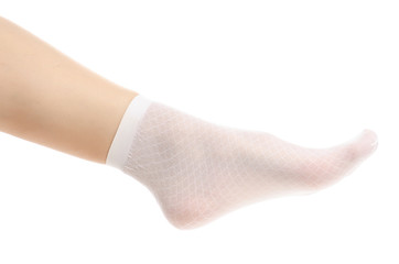 Female legs in white nylon socks on white background. Isolation